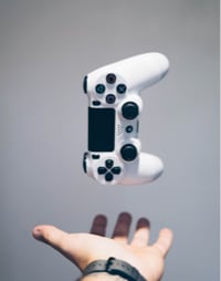 a hand with controller above